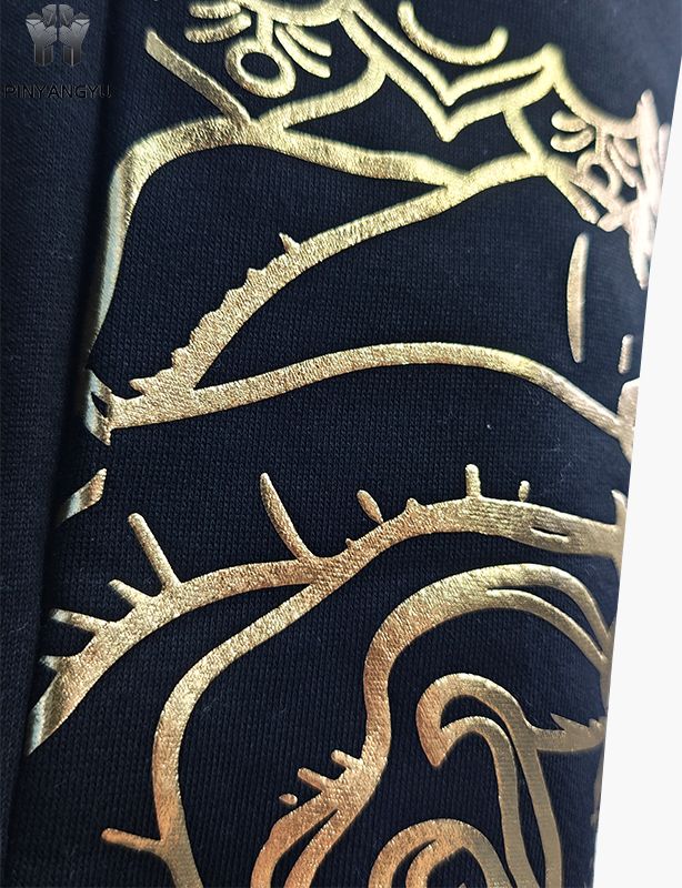 Pantalones con diseño de diamantes de imitación y estampado dorado