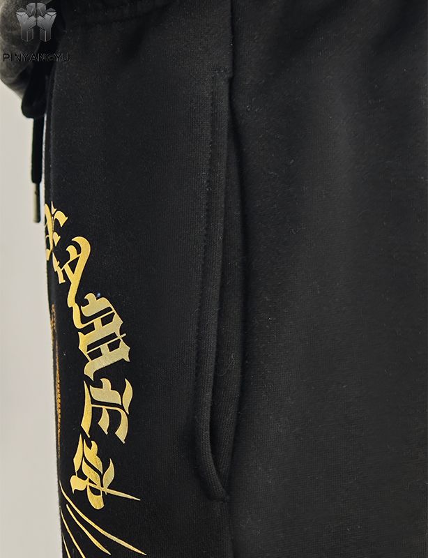 Pantalones con diseño de diamantes de imitación y estampado dorado